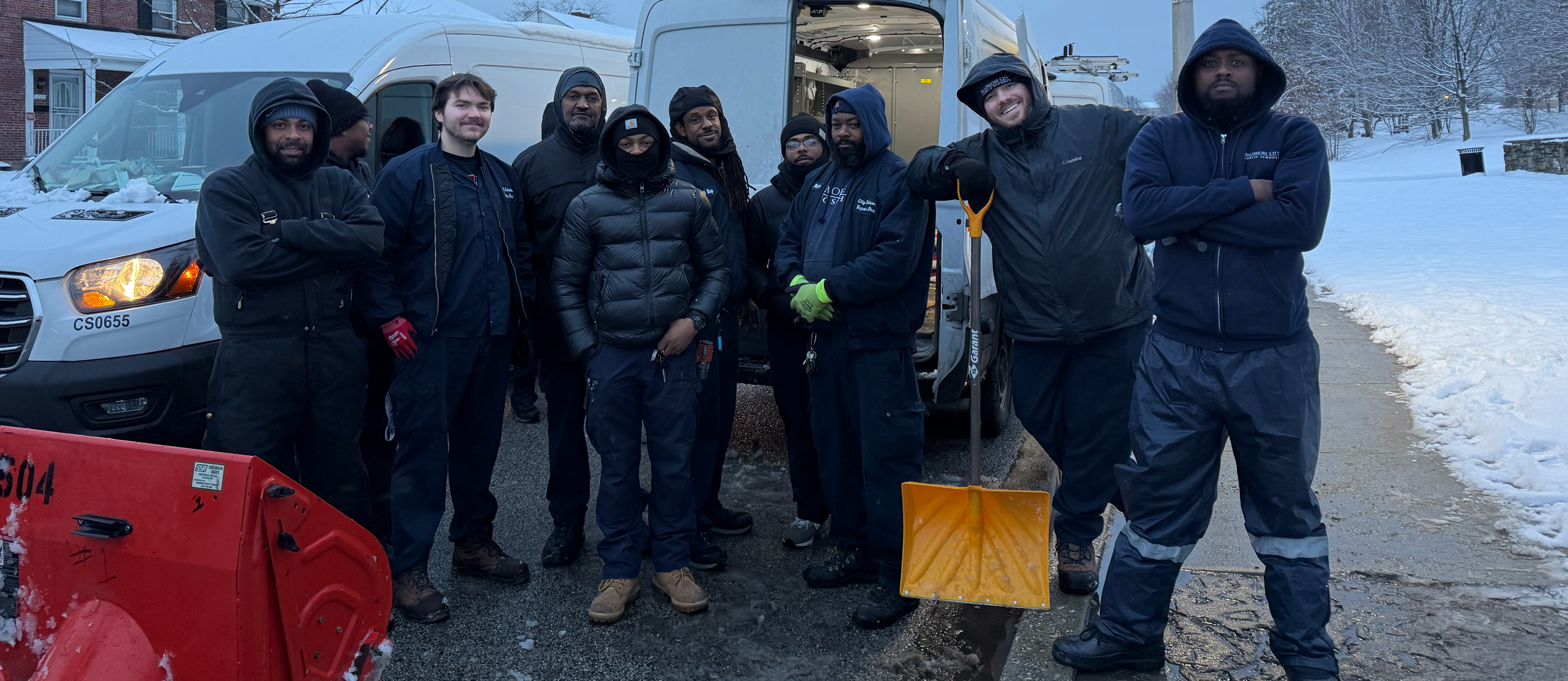 Early morning facilities crew poses for a picture at Mervo