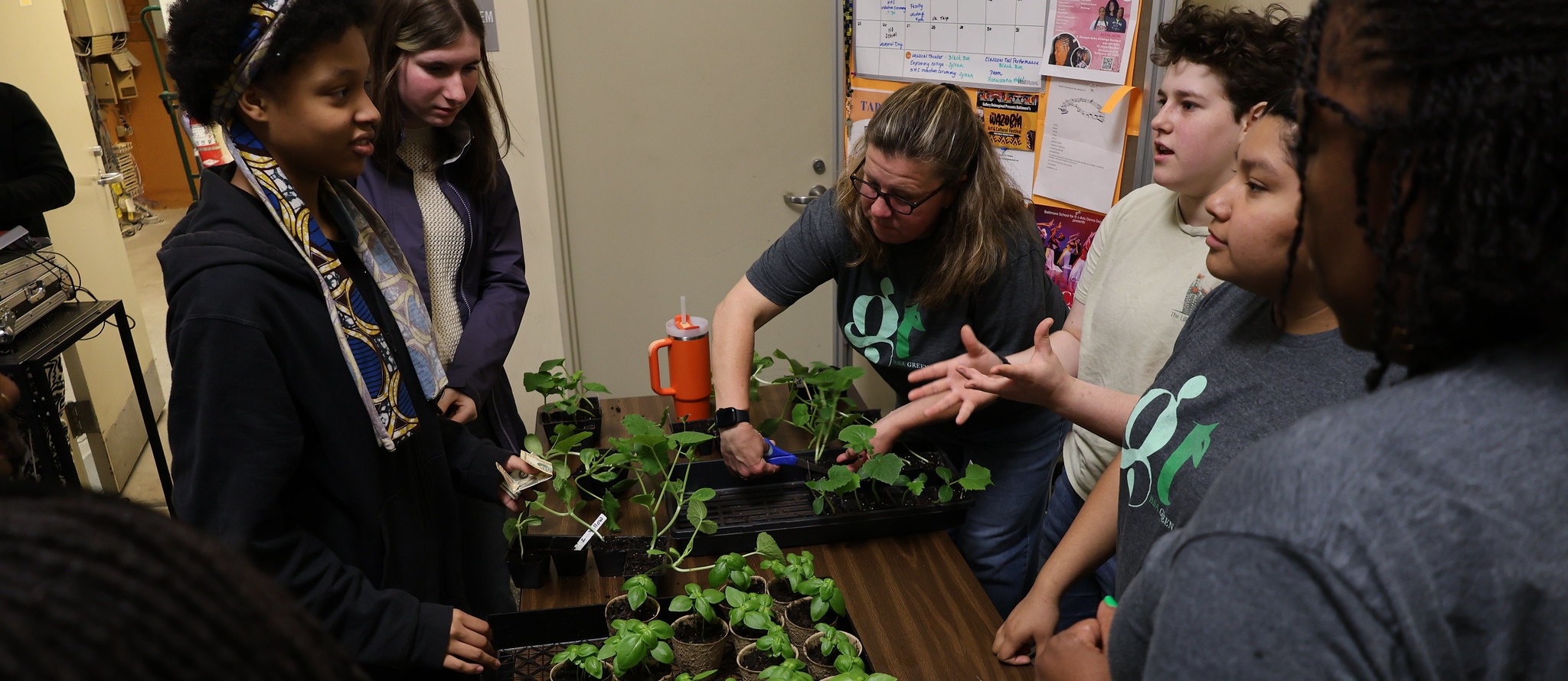 BSA students buy and sell seedlings on neighborhood cleanup day.