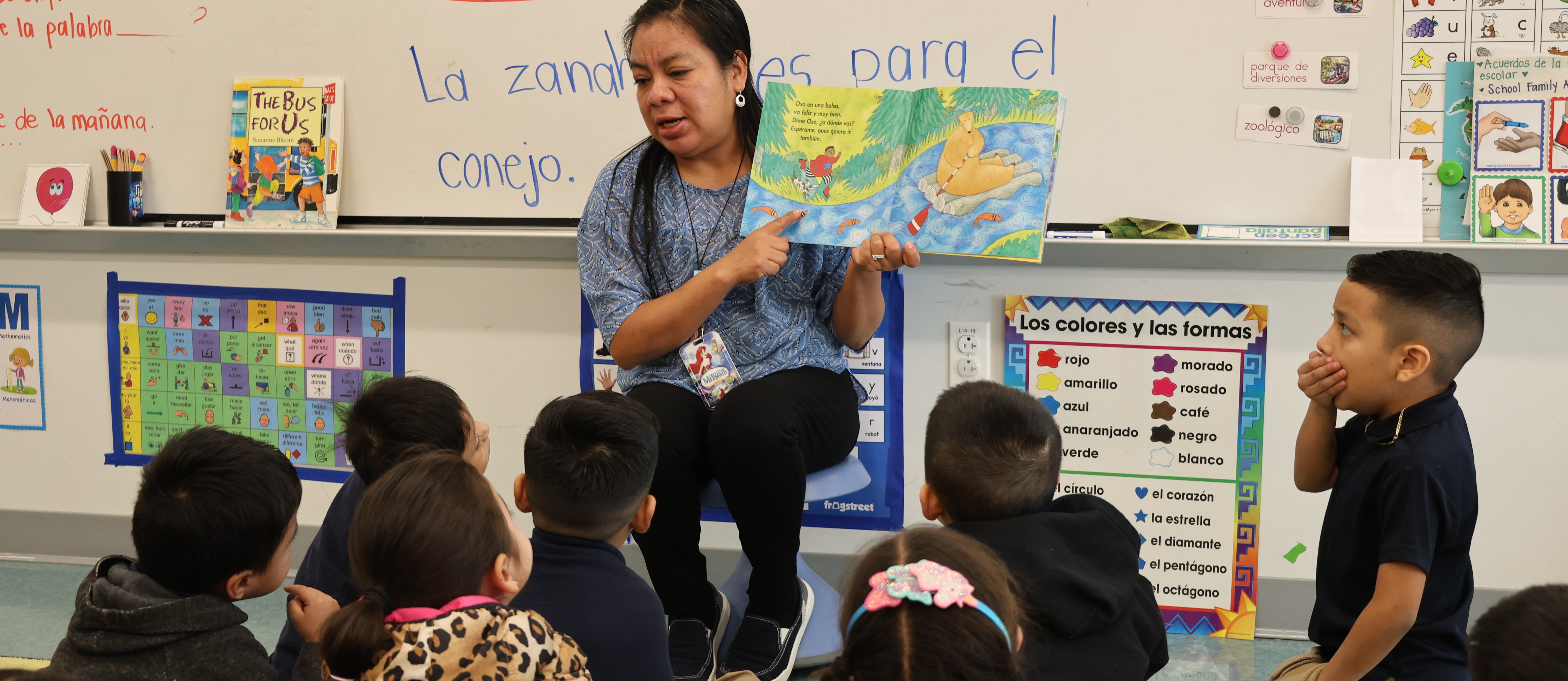 Teacher reading to their class on the carpet