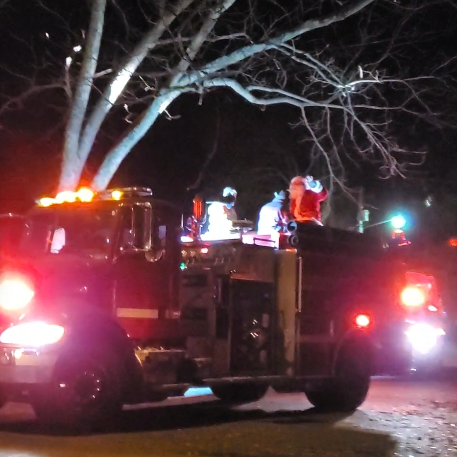 volunteer fire department driving santa through des arc