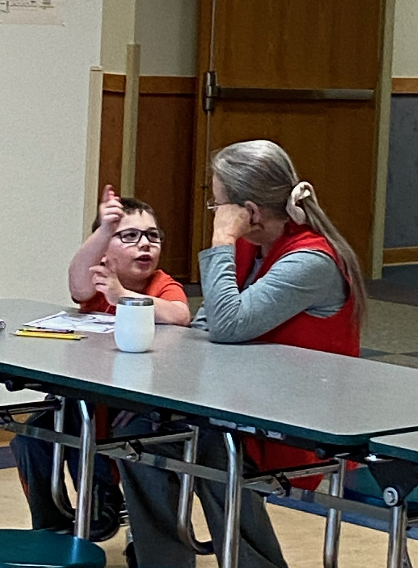 Foster Grandparent Carrie helping a second grader