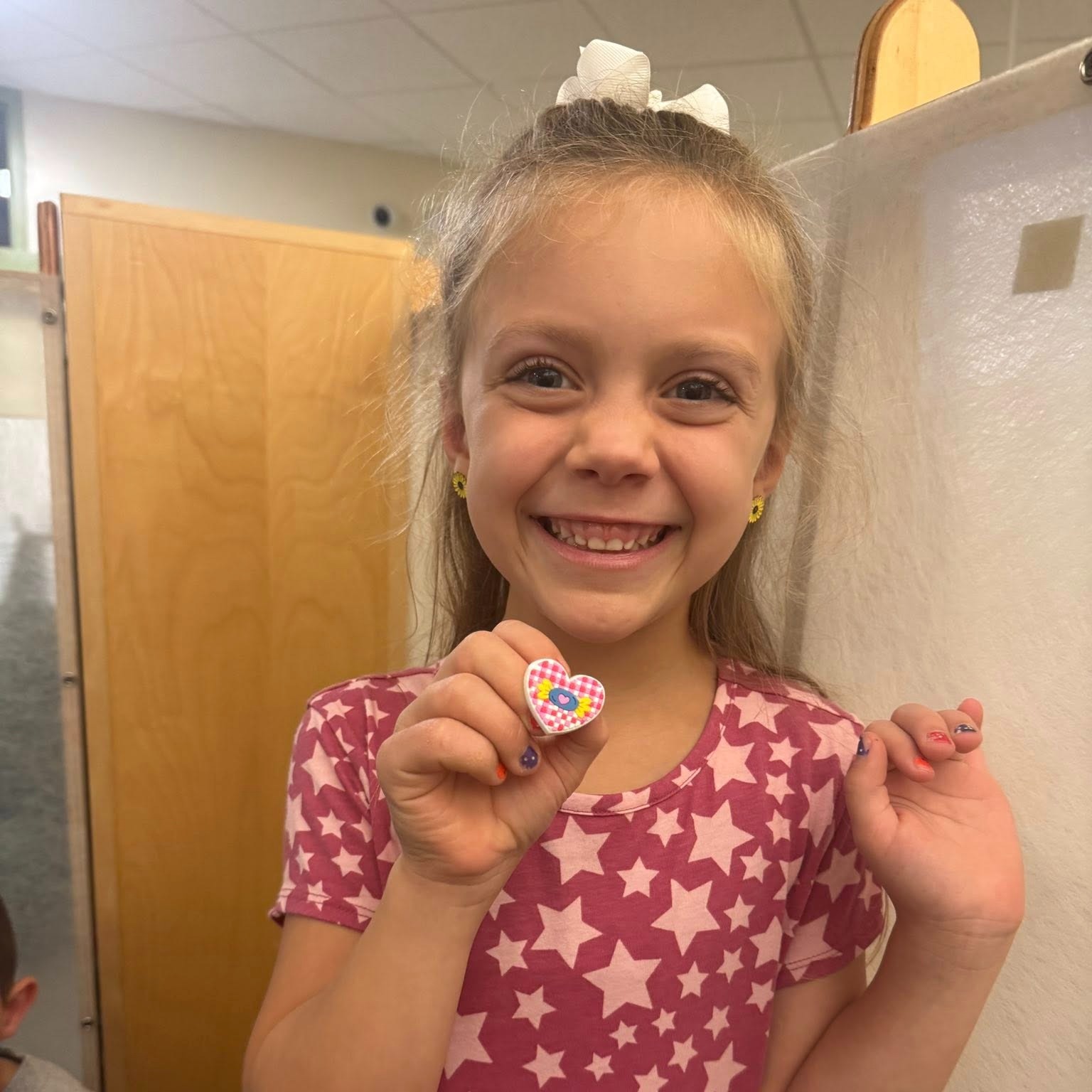 Hannah smiling with a prize