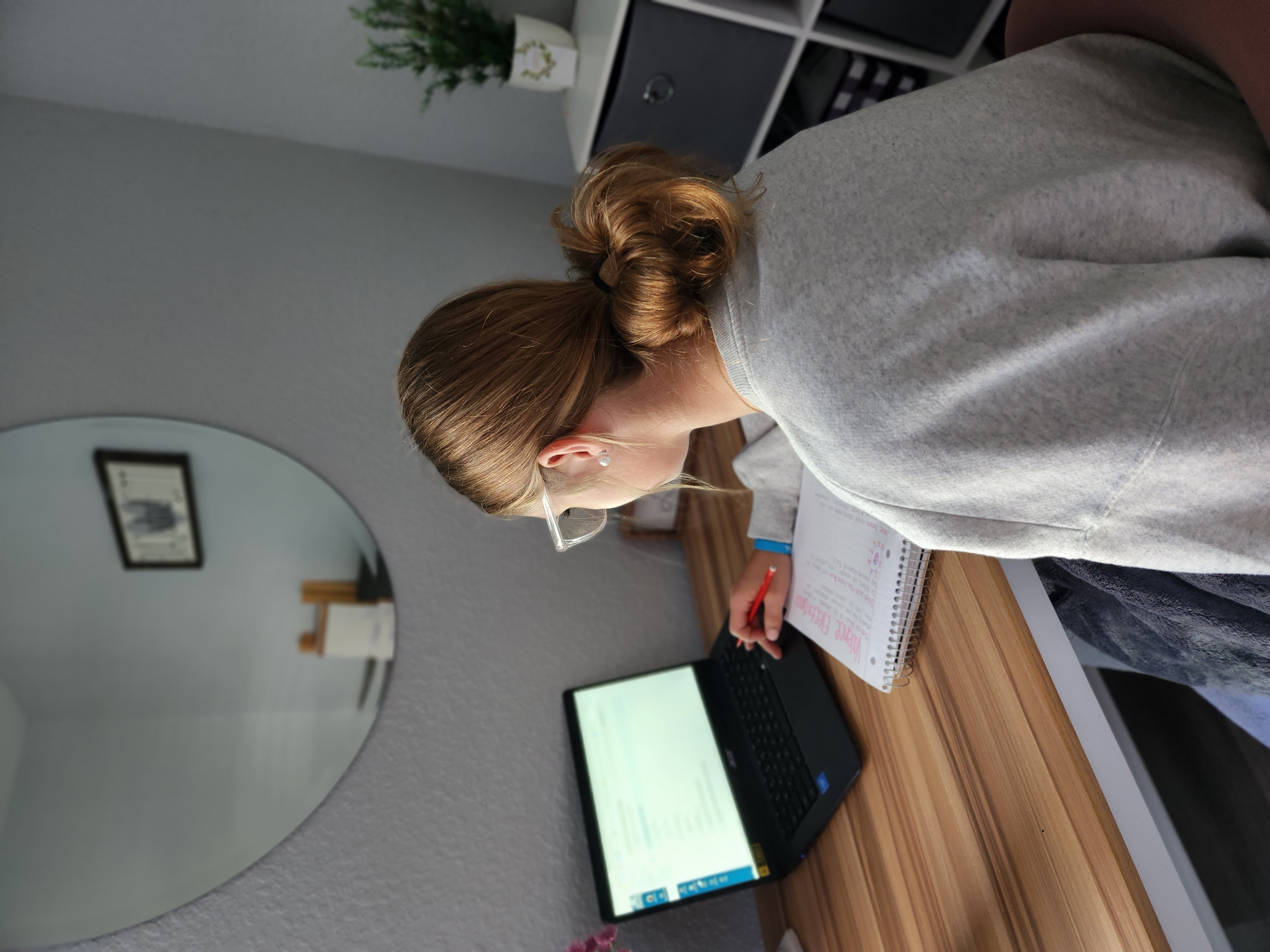 student at computer at home