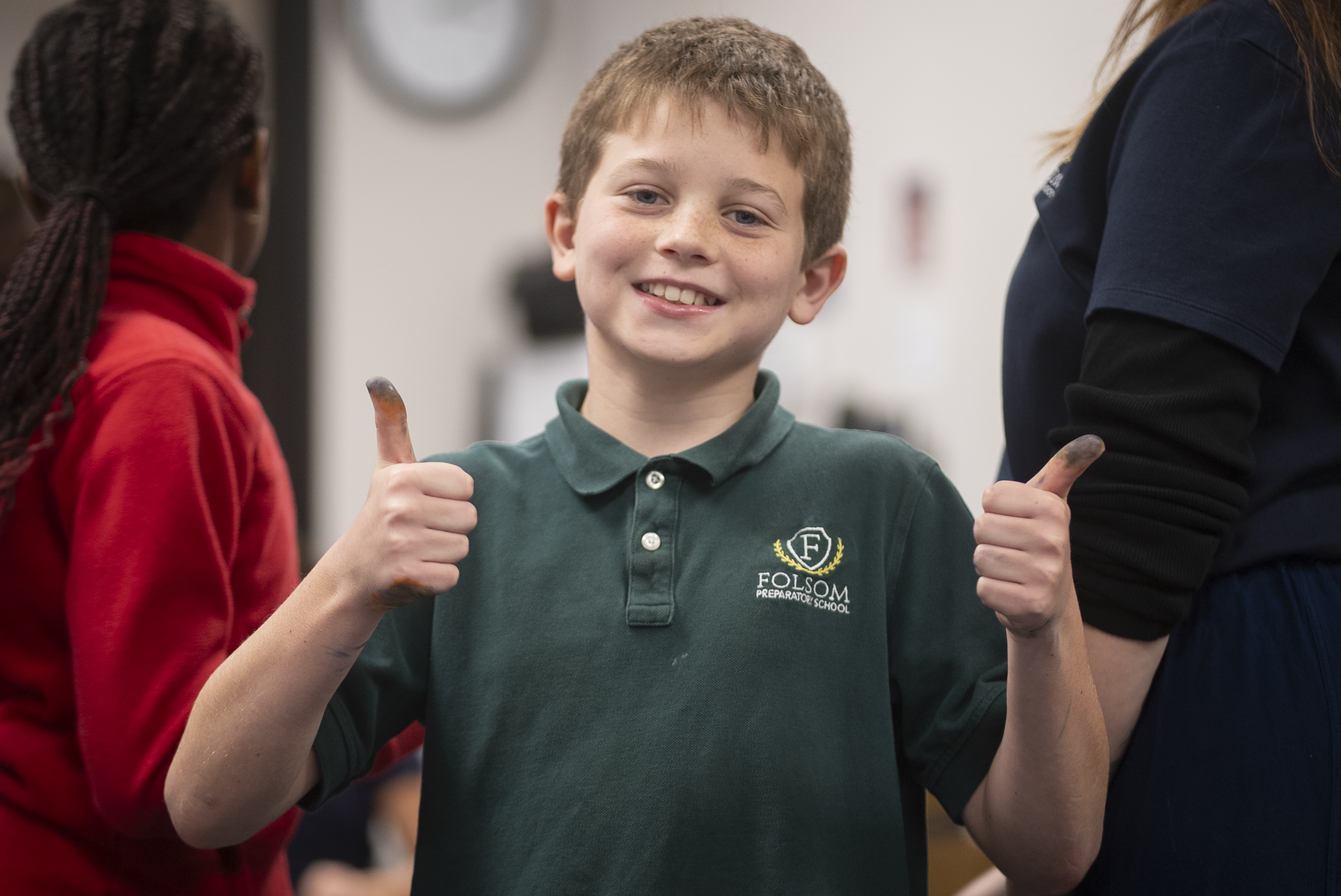 Boy in green shirt smiling