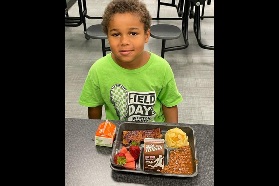 elementary student with his lunch