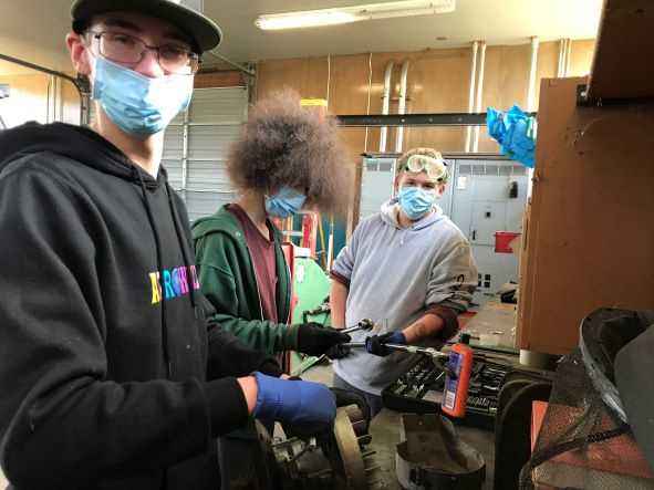 Students repairing an engine