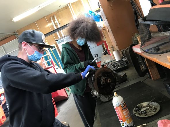 Students repairing an engine