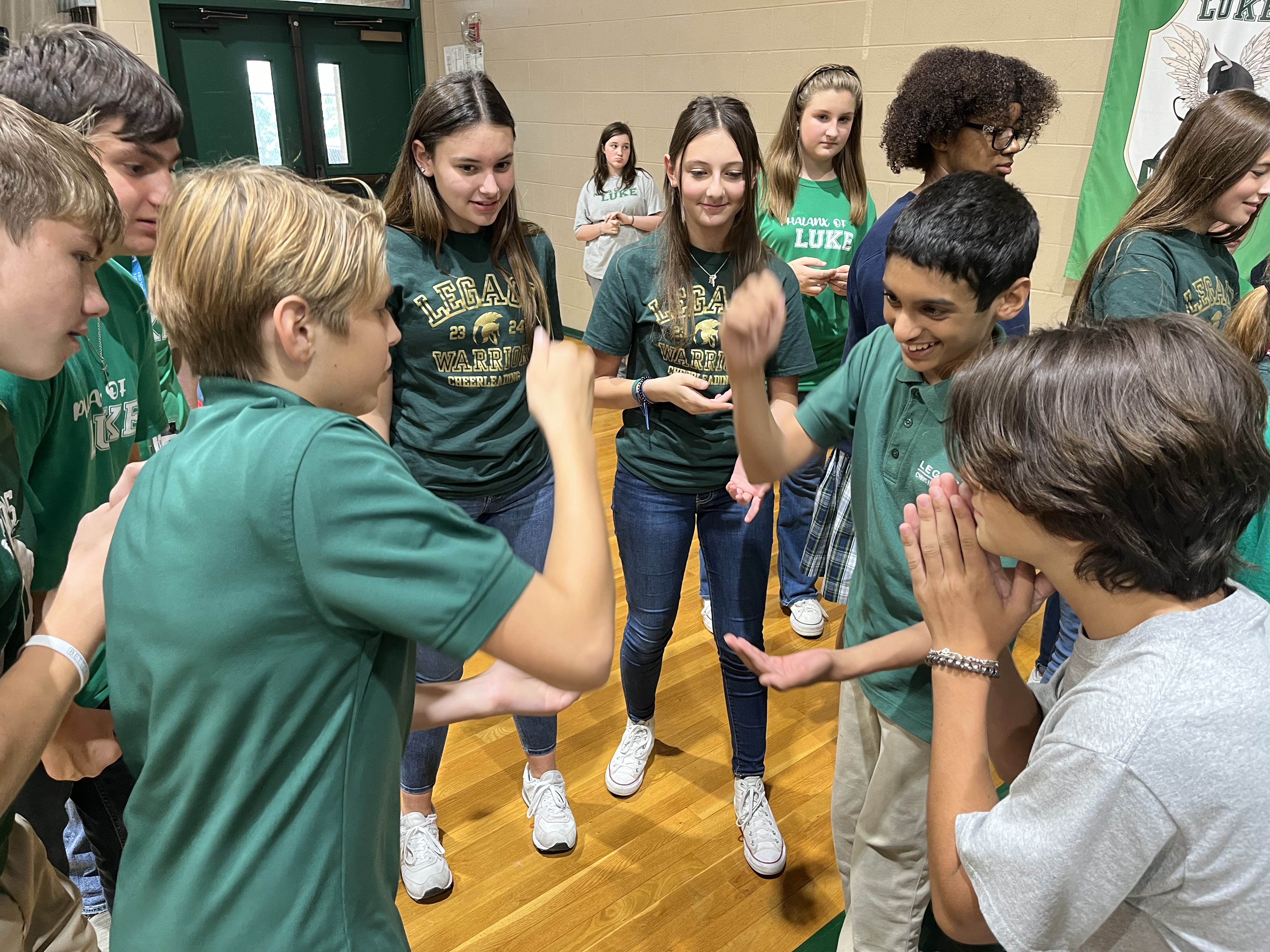 Middle Schoolers playing rock paper scissors