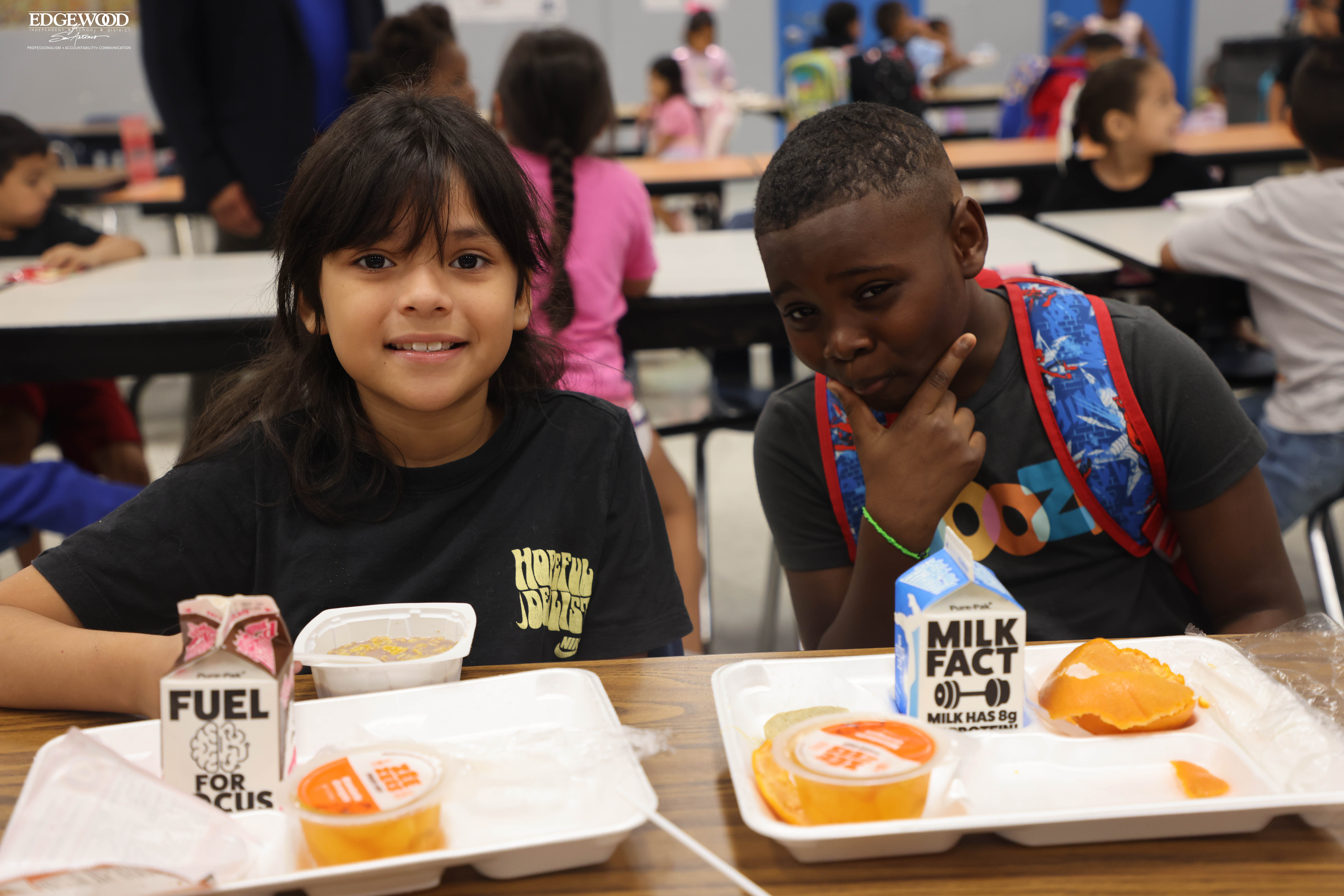 Students pose for a photo while eating breakfast at LBJ