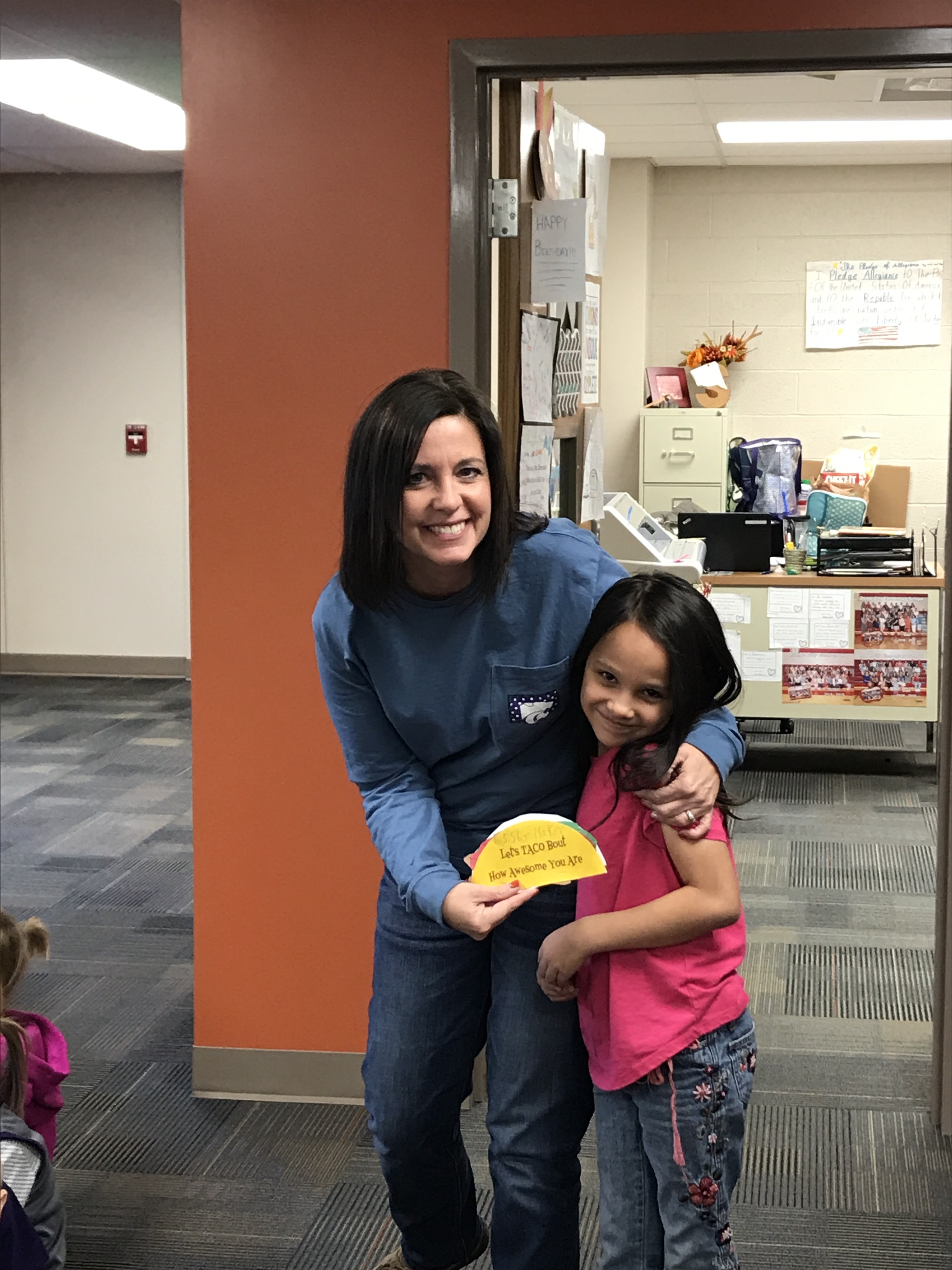 Teacher with student smiling