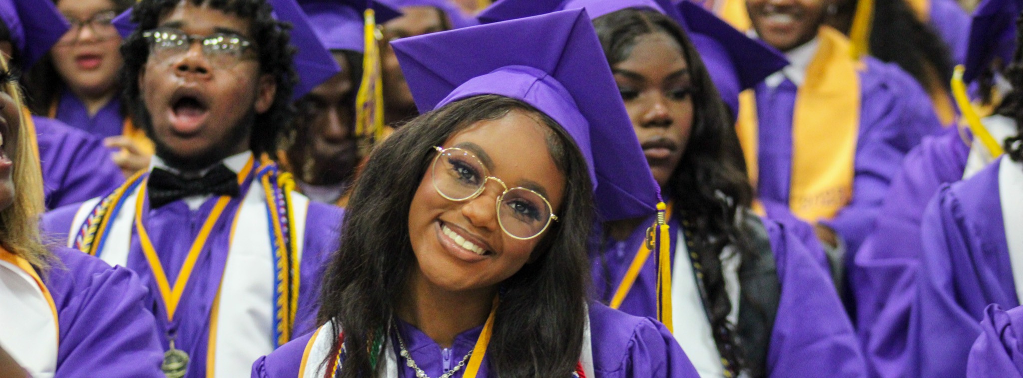 graduation picture - students in cap and gown smiling