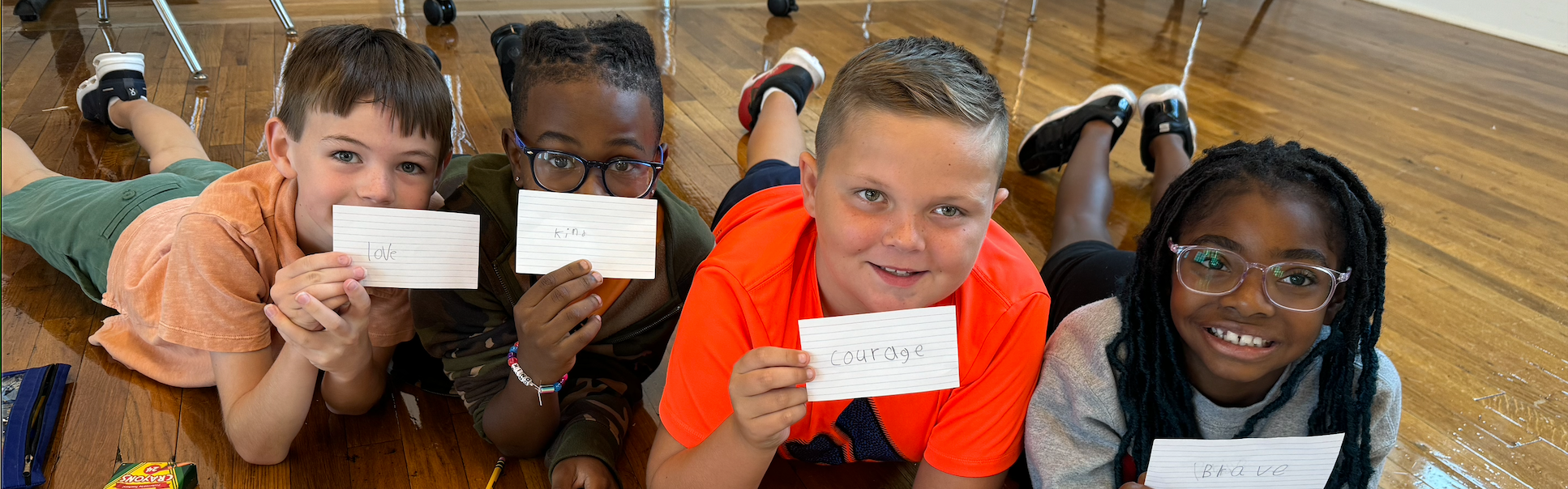 Students showing words for the year on cards