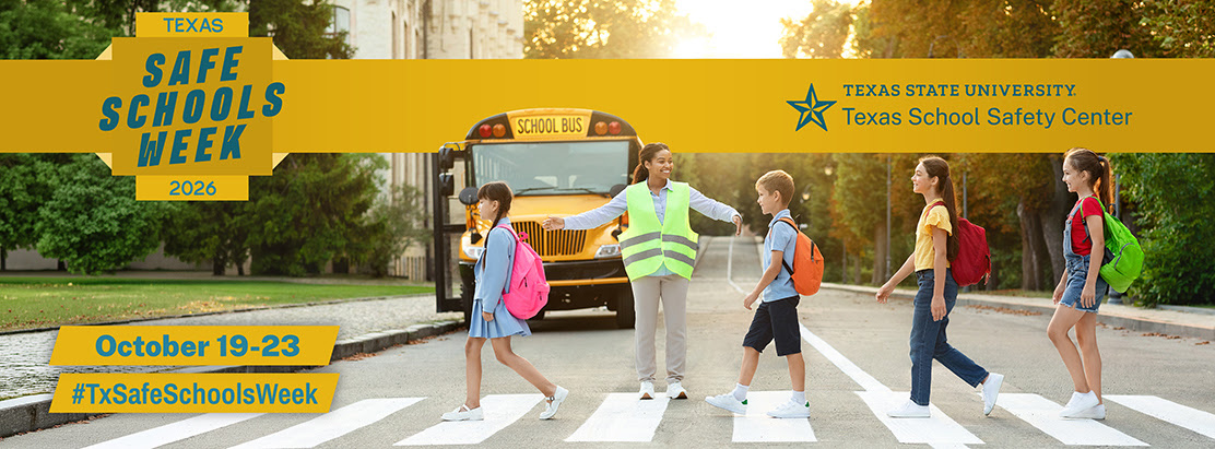 Children crossing street in front of school bus. Woman in yellow vest walking with children.