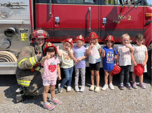 Kids with firefighter truck