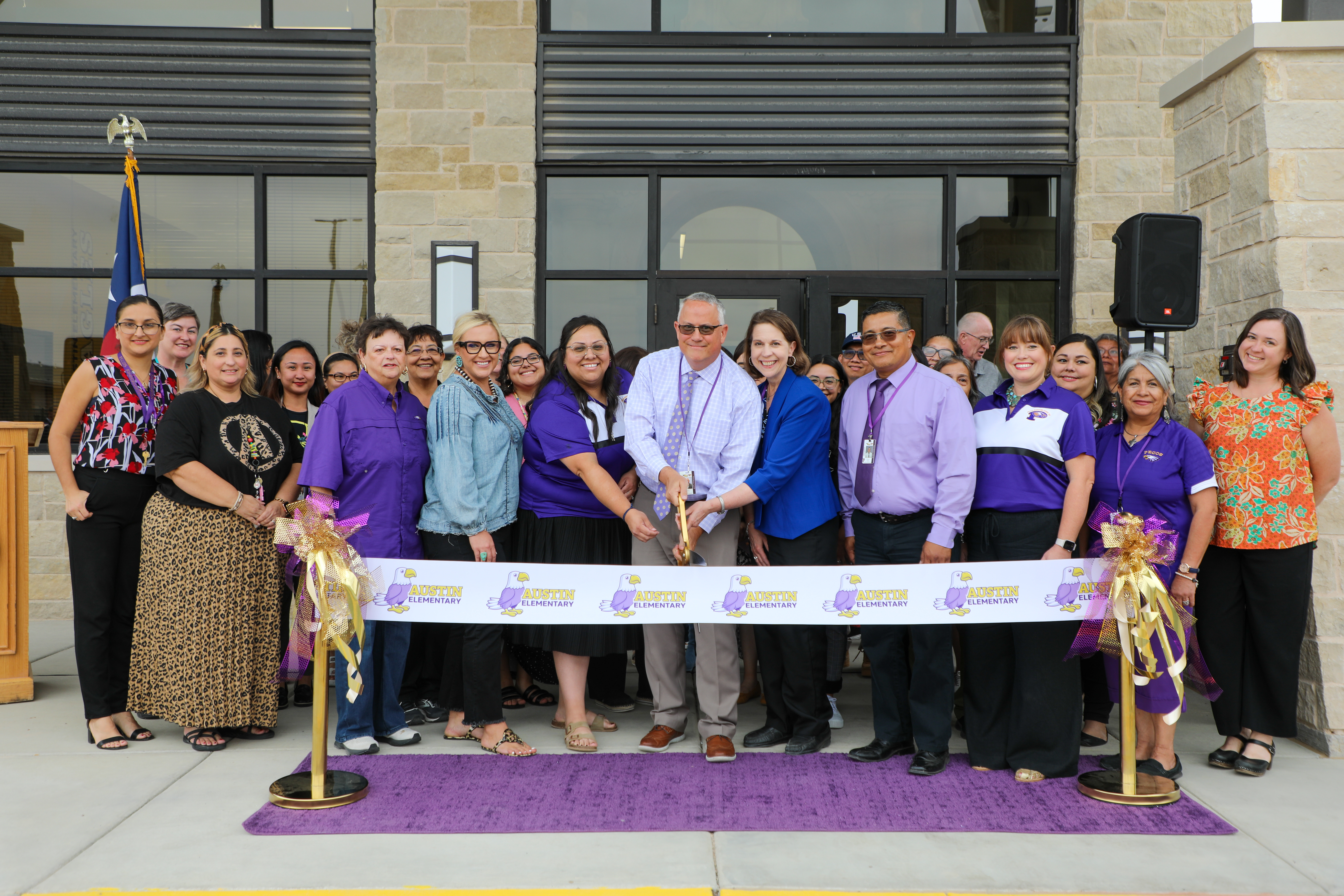 school officials cutting ribbon for austin elementary 