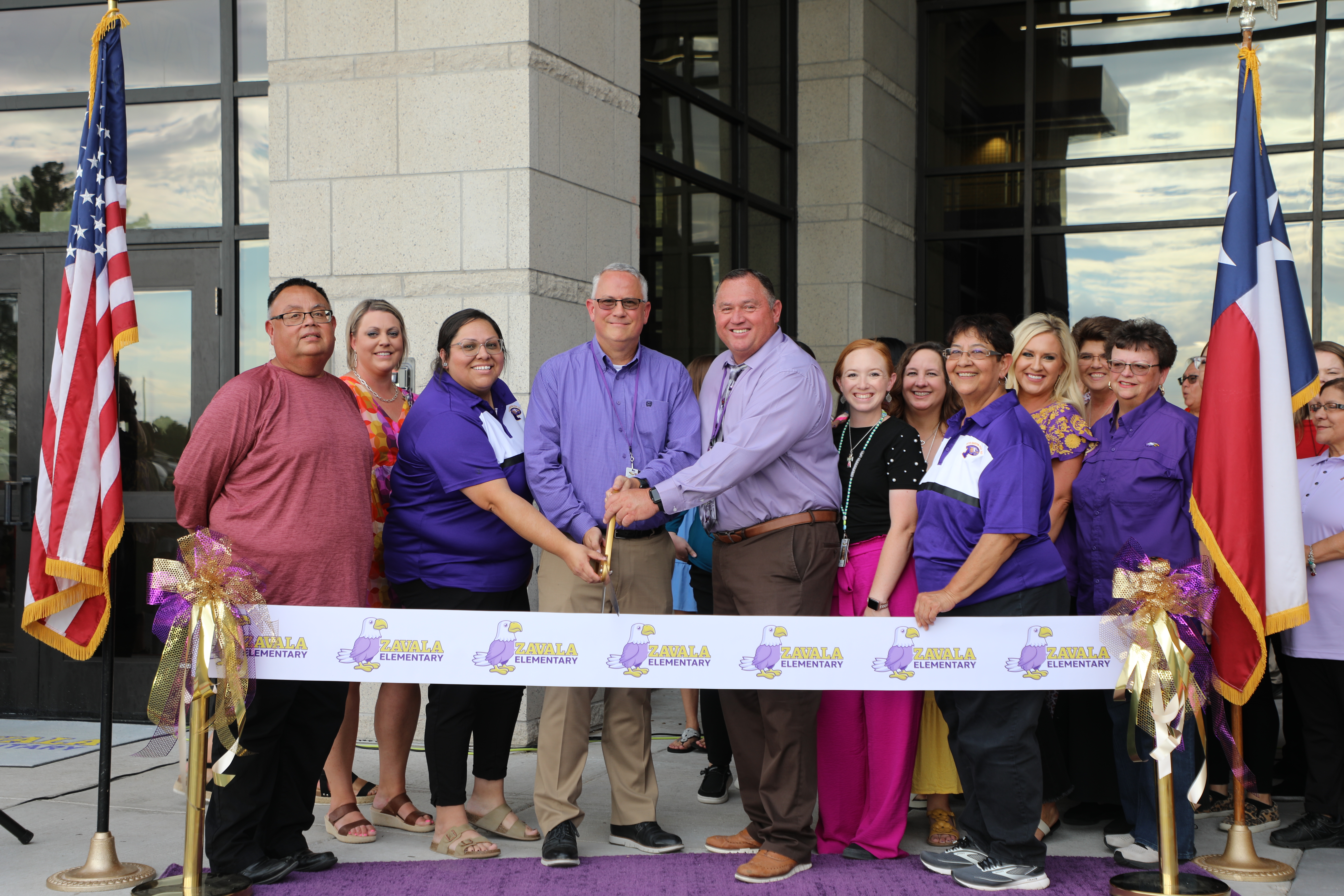 leadership cutting ribbon for zavala elementary grand opening