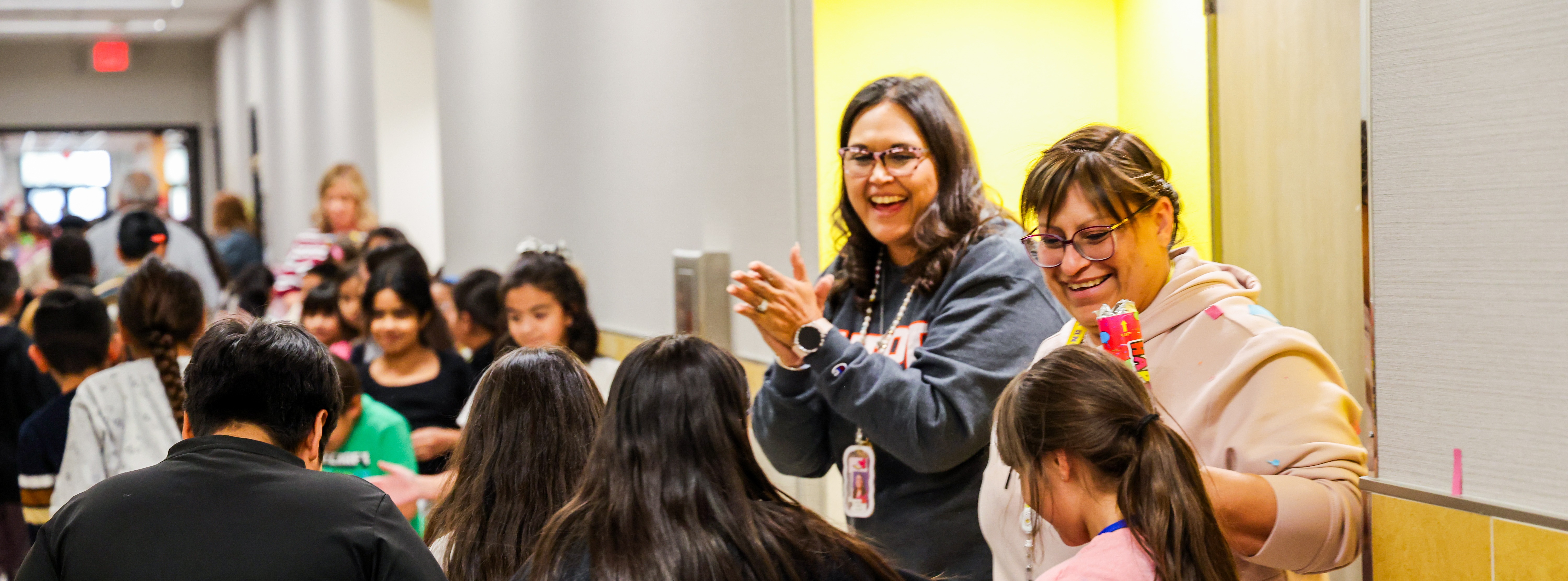 Zavala Elementary staff clap for students walking in the TELPAS Parade