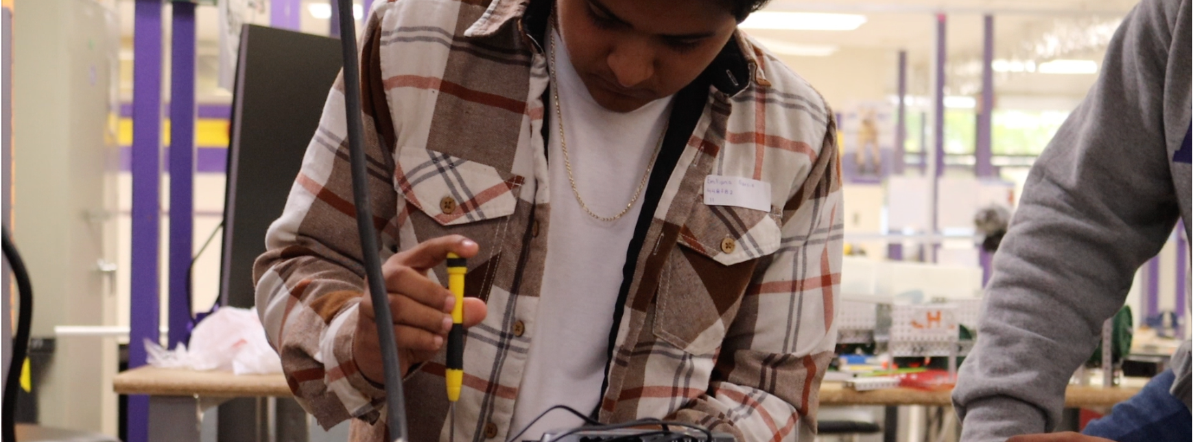 student working on robot