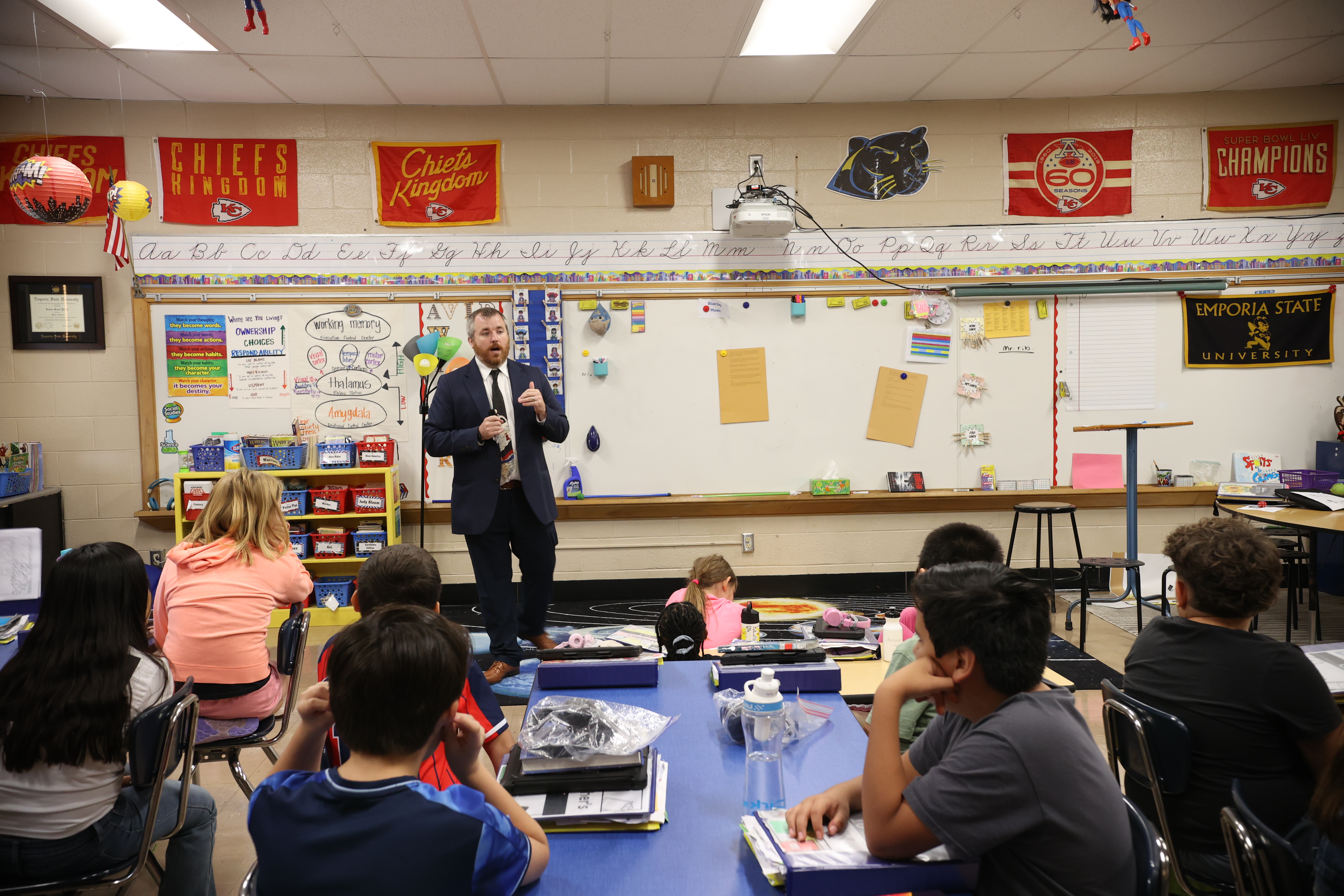 Teacher at front of classroom.