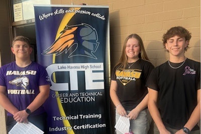 students standing in front of CTE sign