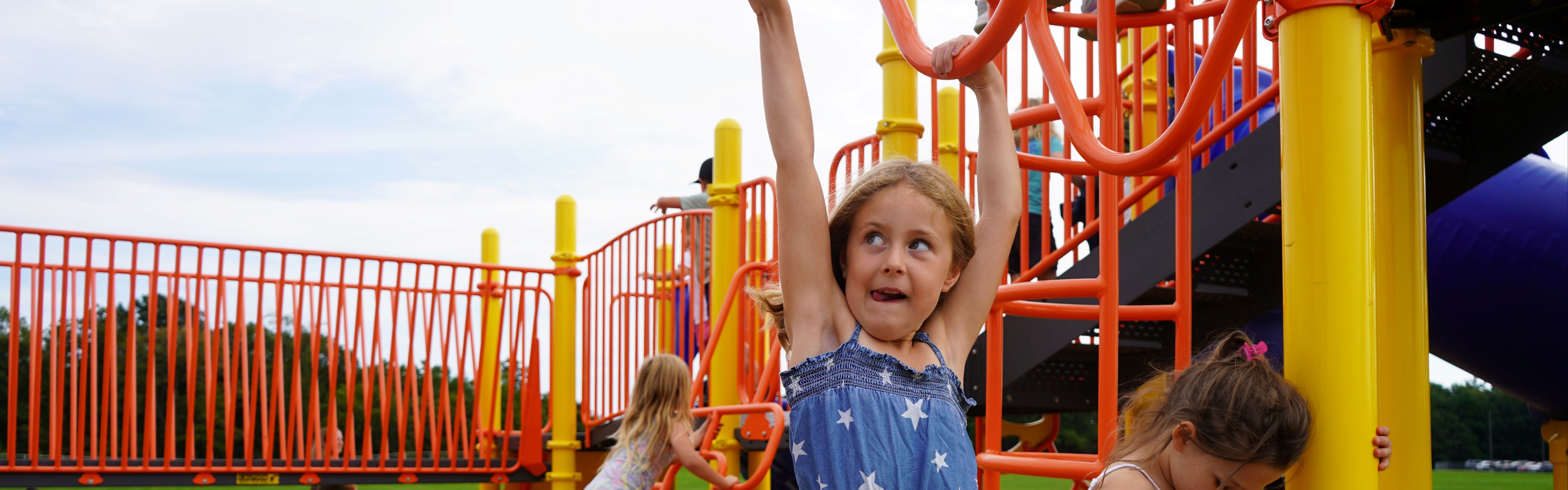 Student plays on the QES playground.