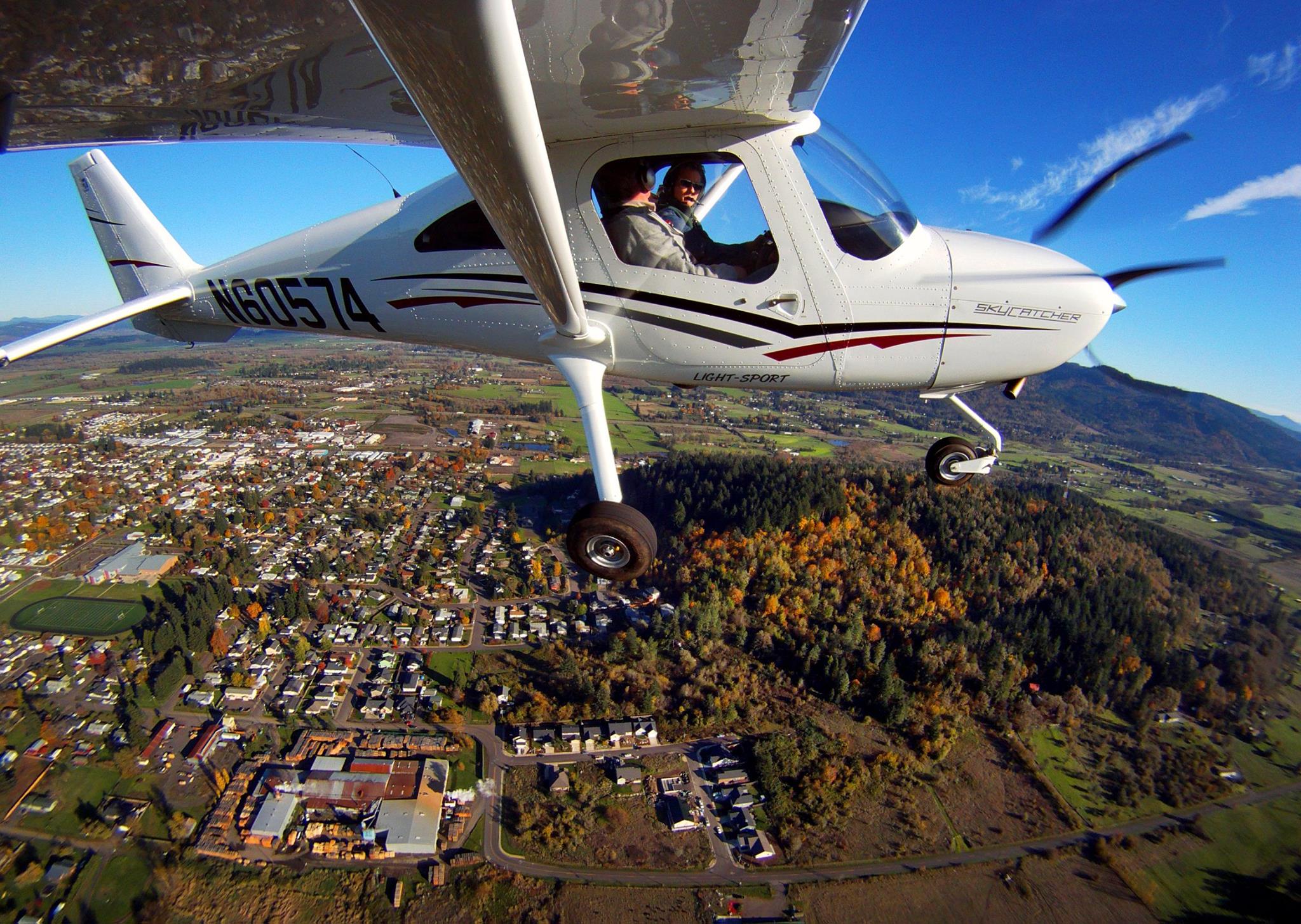 Image of an airplane flying over Creswell