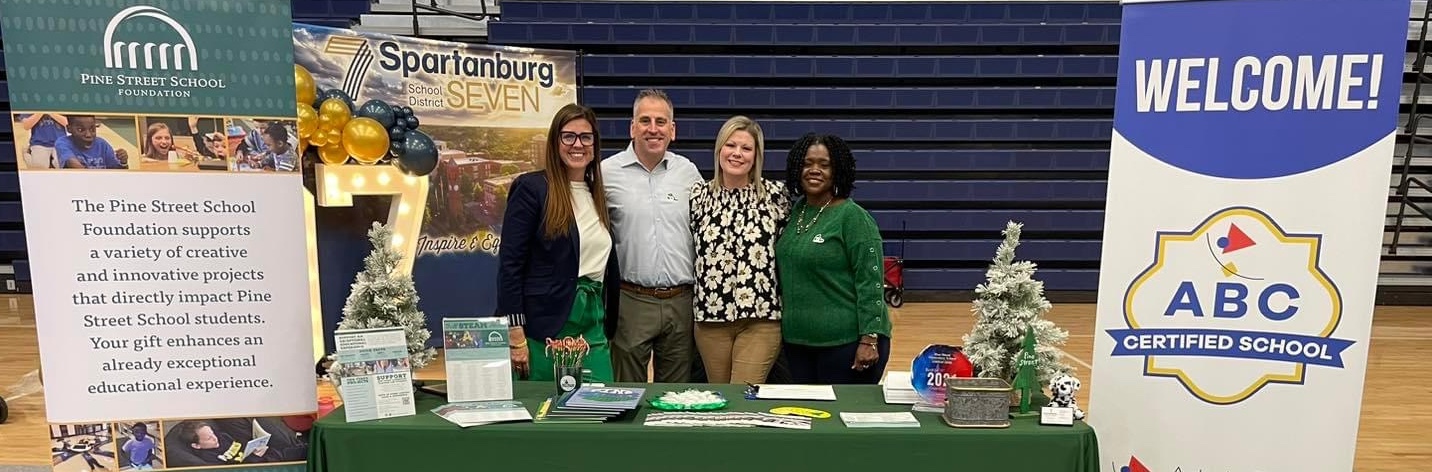 teachers and staff at the recruitment fair welcoming guests