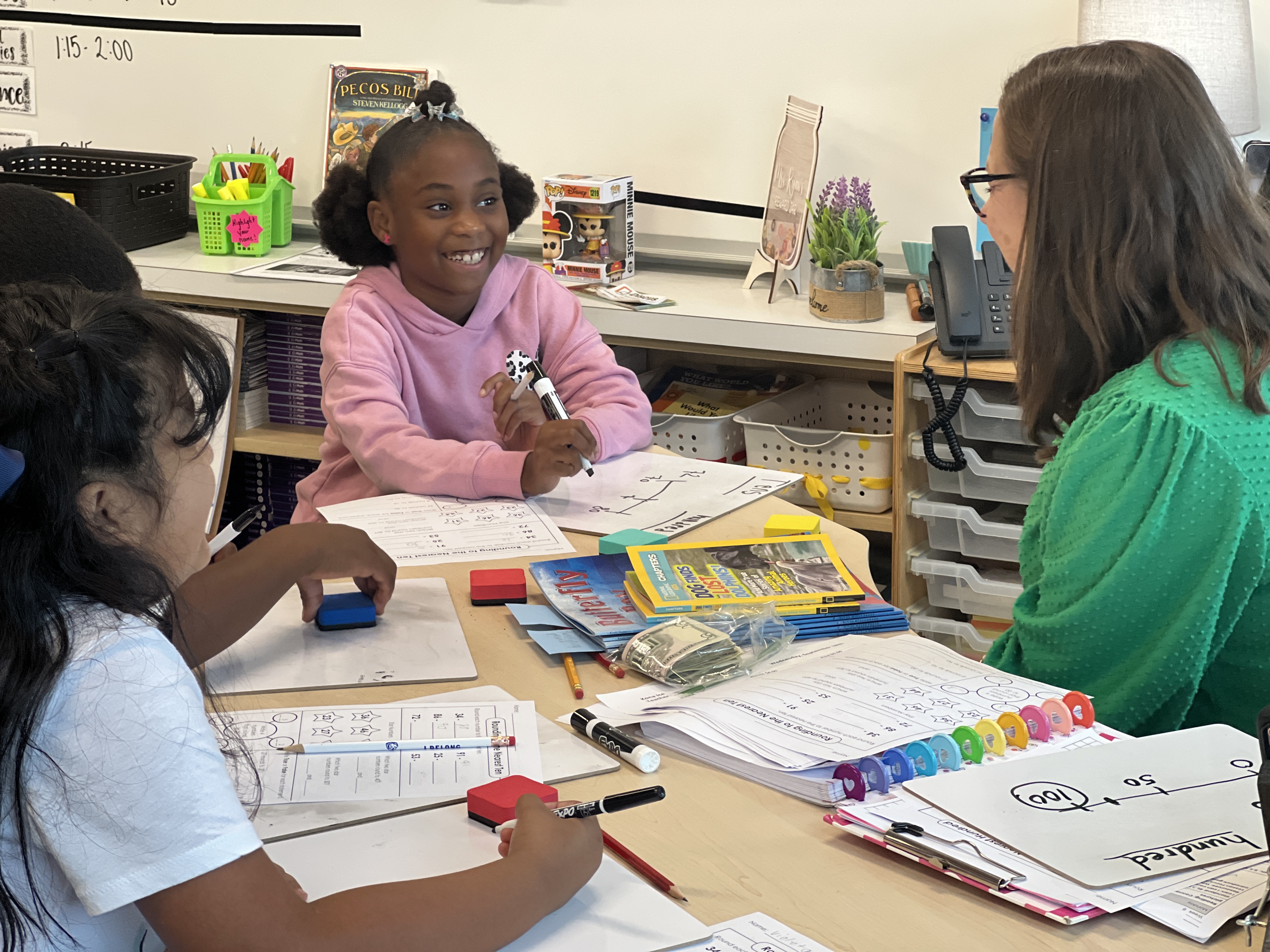 A teacher works with her students