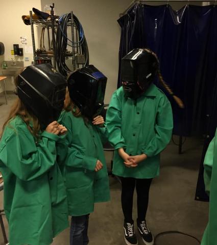 Students waring helmets 