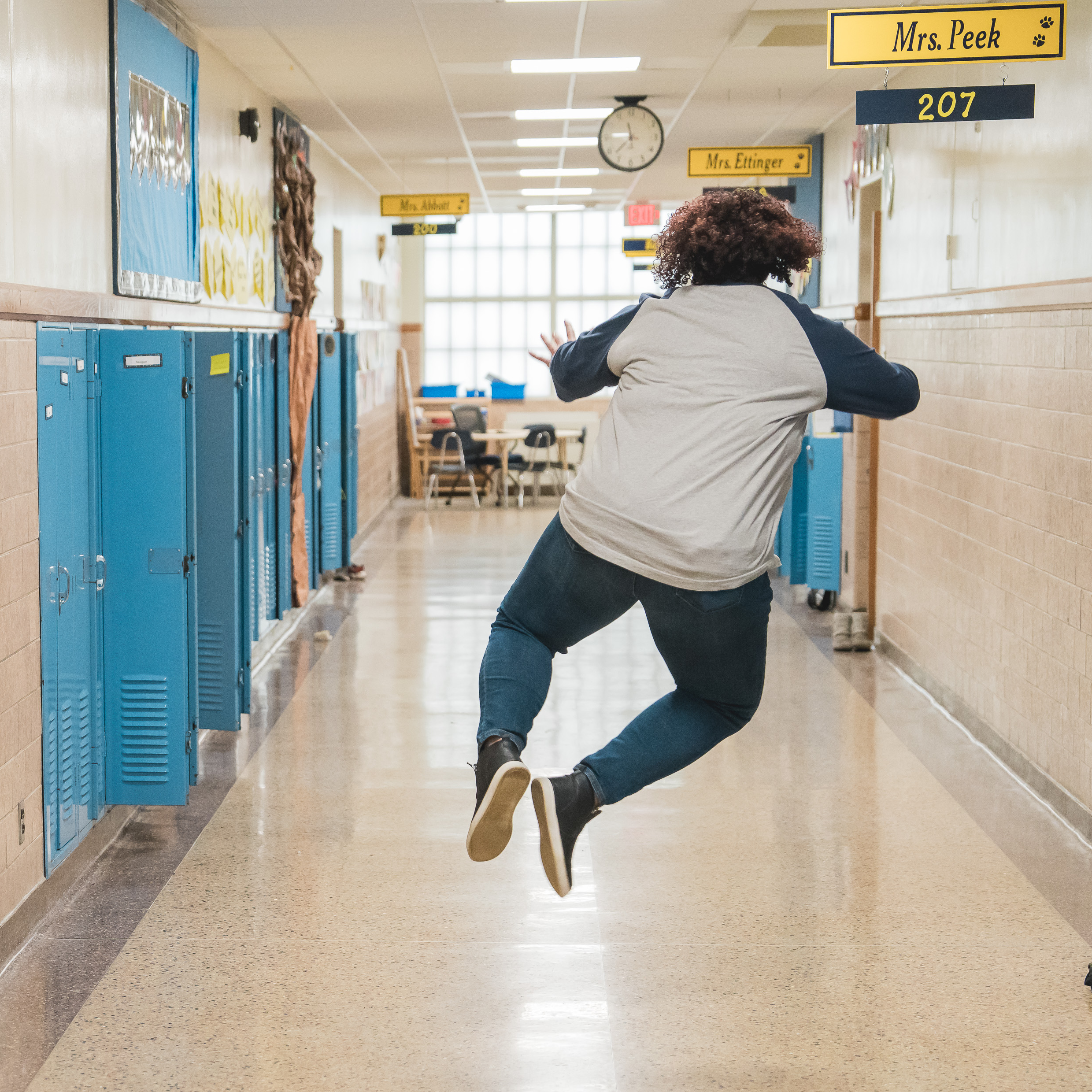 St. Joseph teacher jumping for joy in hallway
