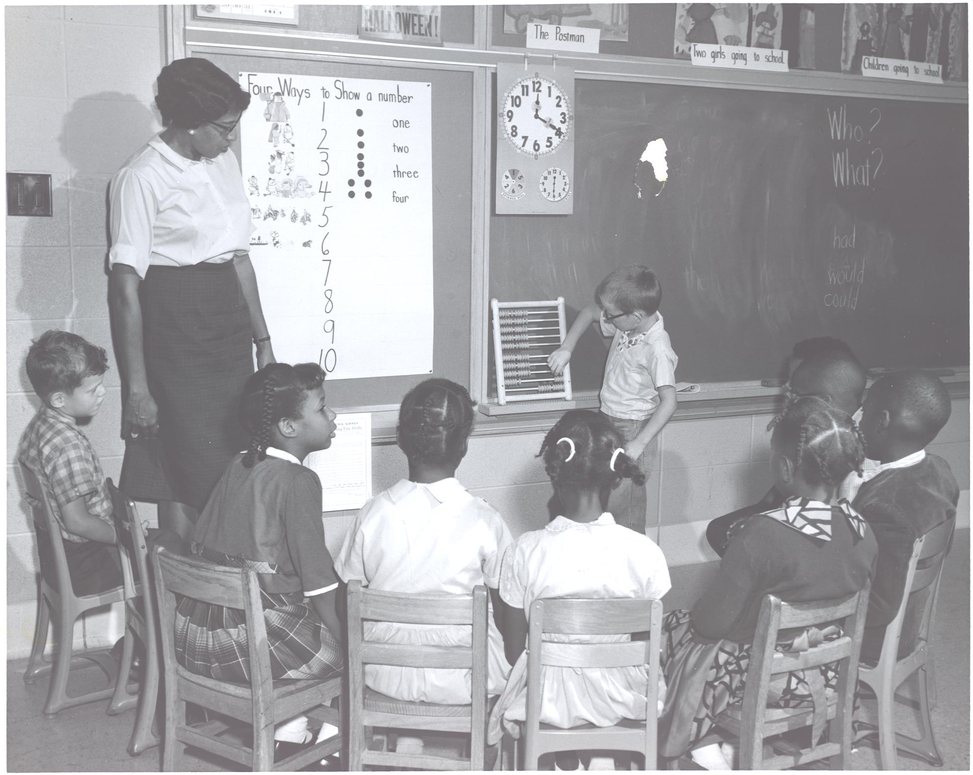 Teacher in her classroom with students