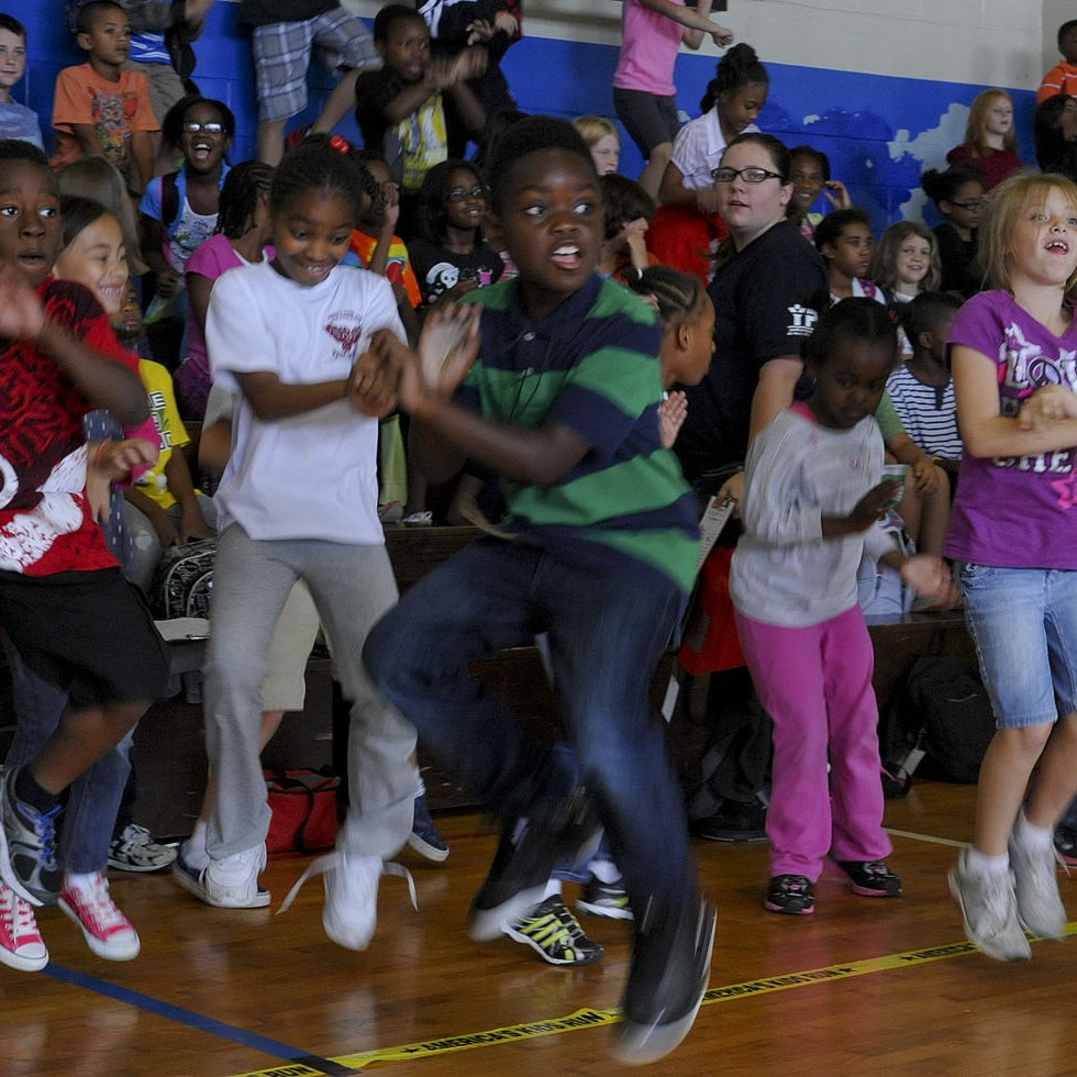 Students dancing in gymnasium