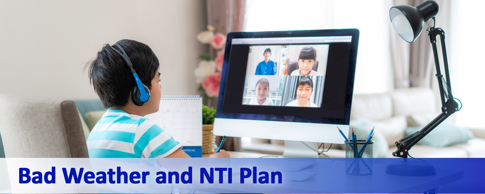 Bad Weather and NTI Plan - picture with a student on a computer learning