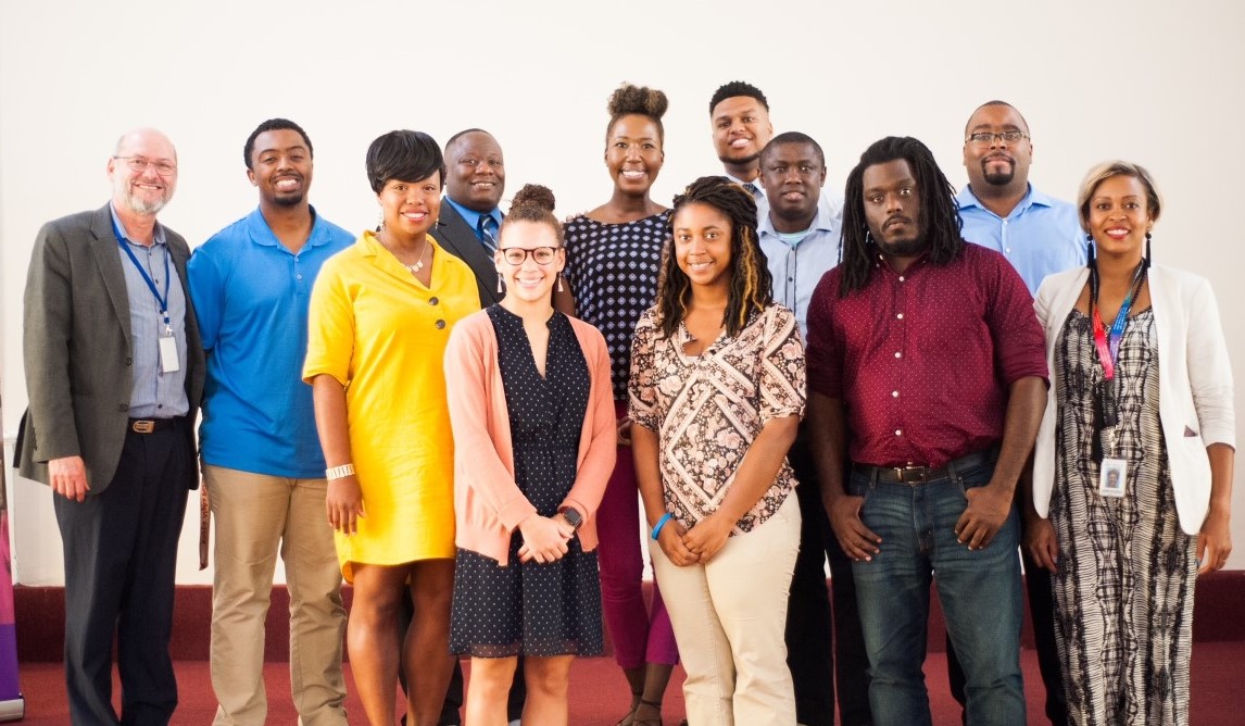 Group of employees standing for photo