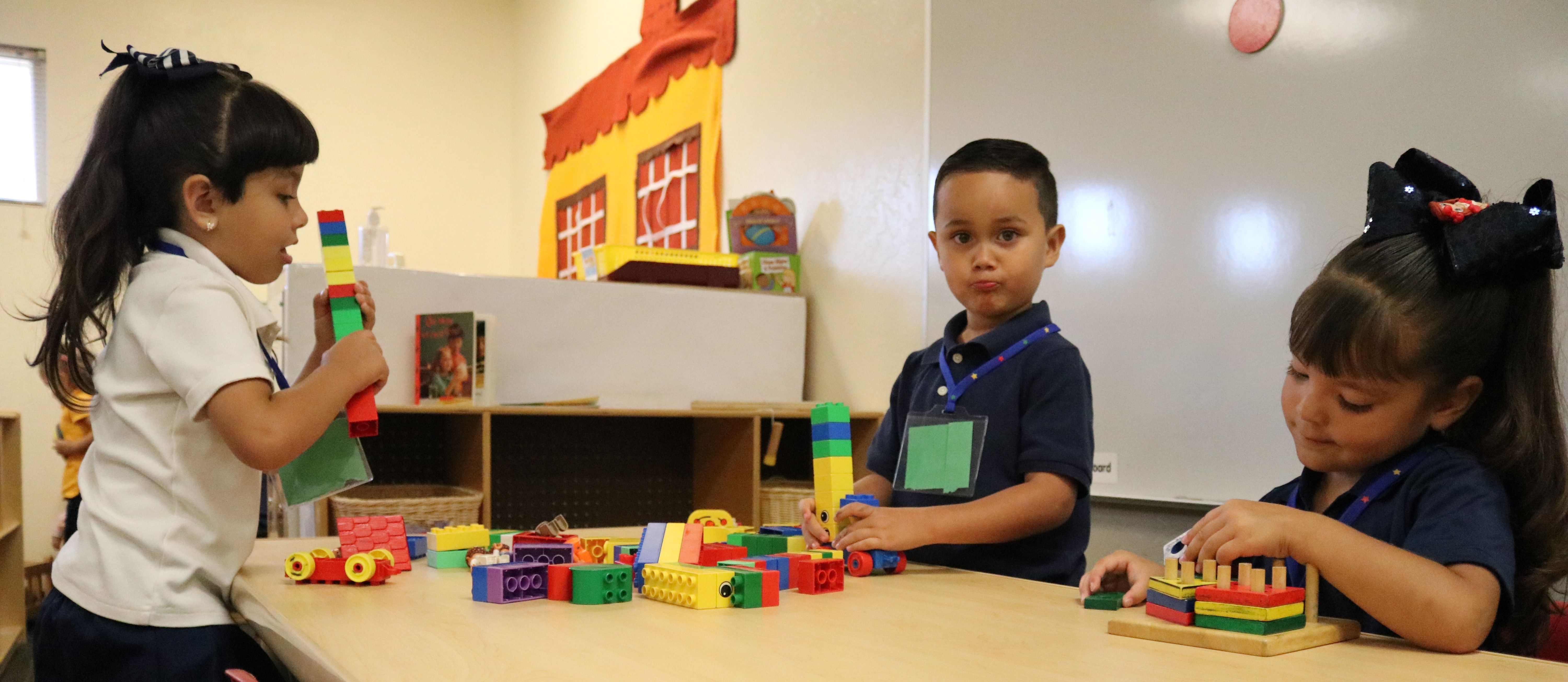 preschool students playing with building blocks