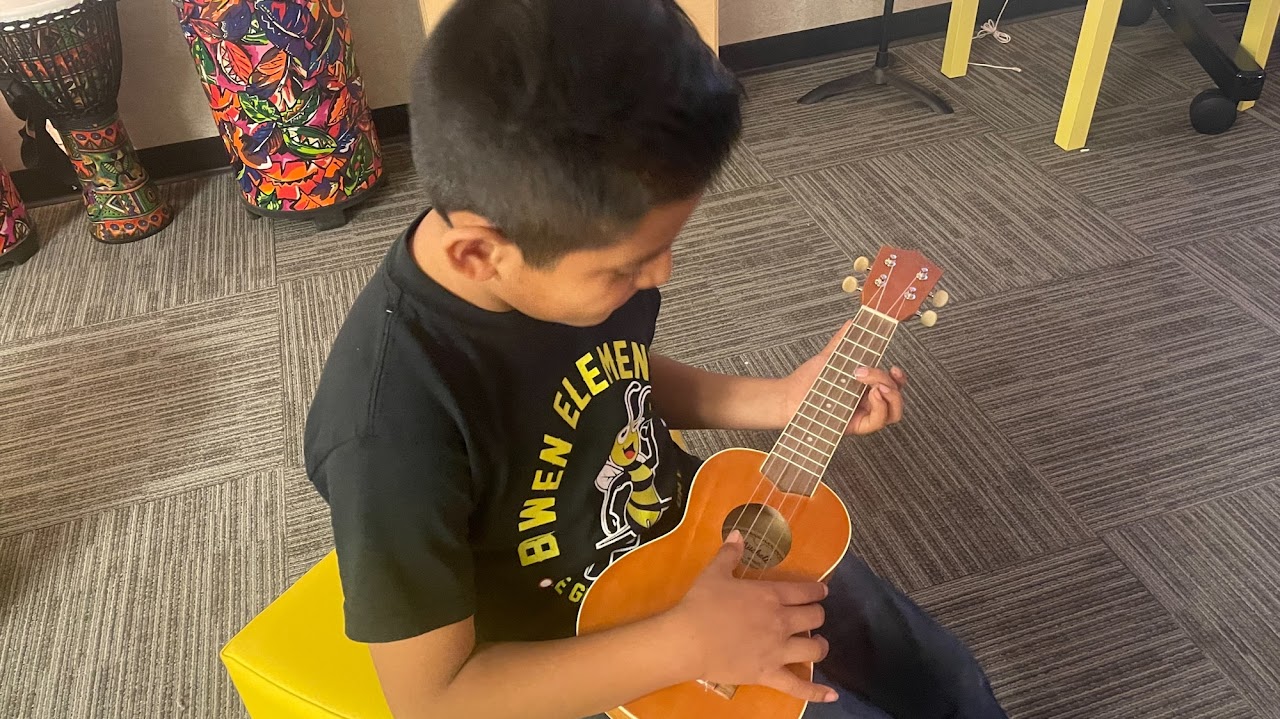 kid playing guitar