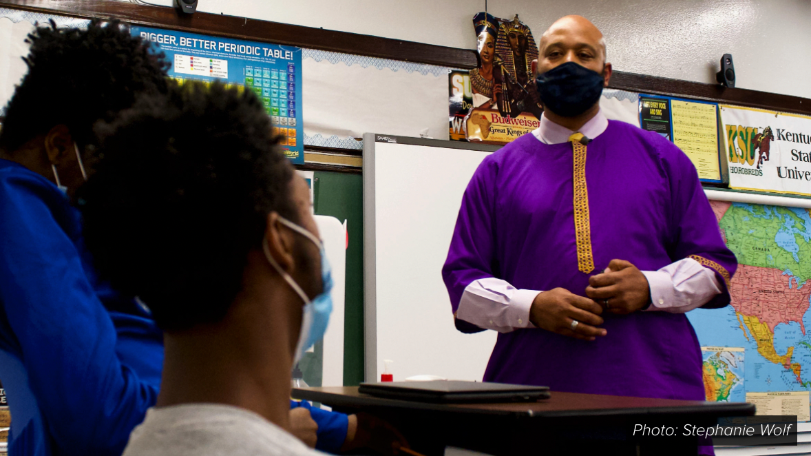  Teacher standing in front of classroom. KY Bill Would Make it Illegal to Teach About Institutional Racism 