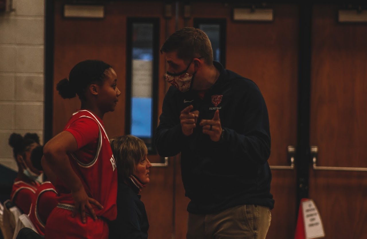 coach talking with a player