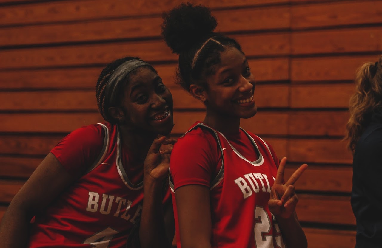 basketball players smiling at the camera