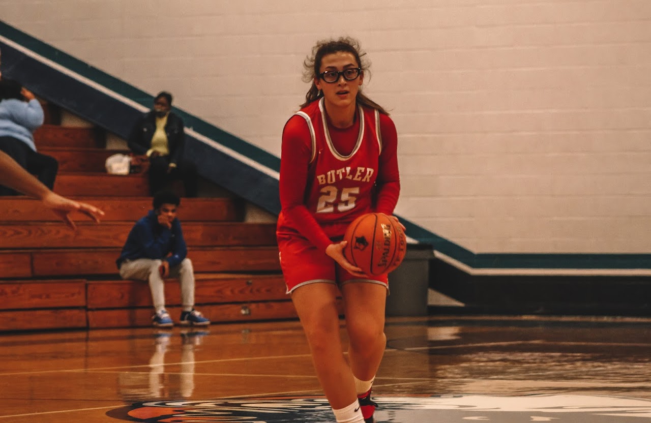 basketball player on the court with the ball