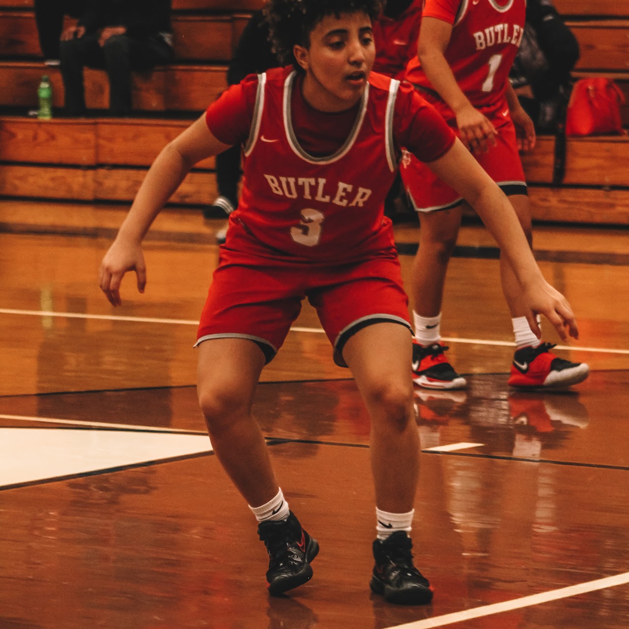 basketball player in the game crouched down