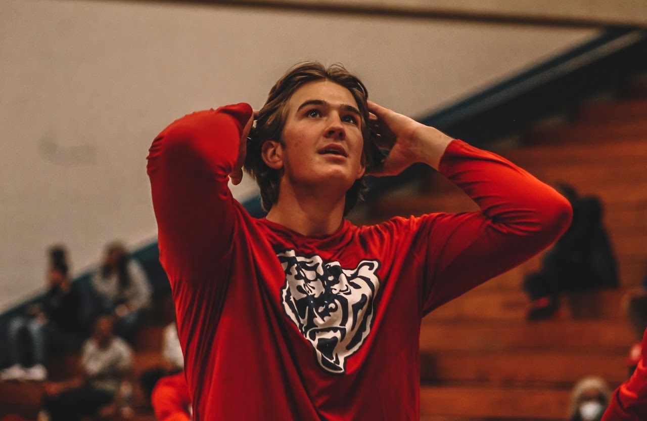 basketball player touching his hair