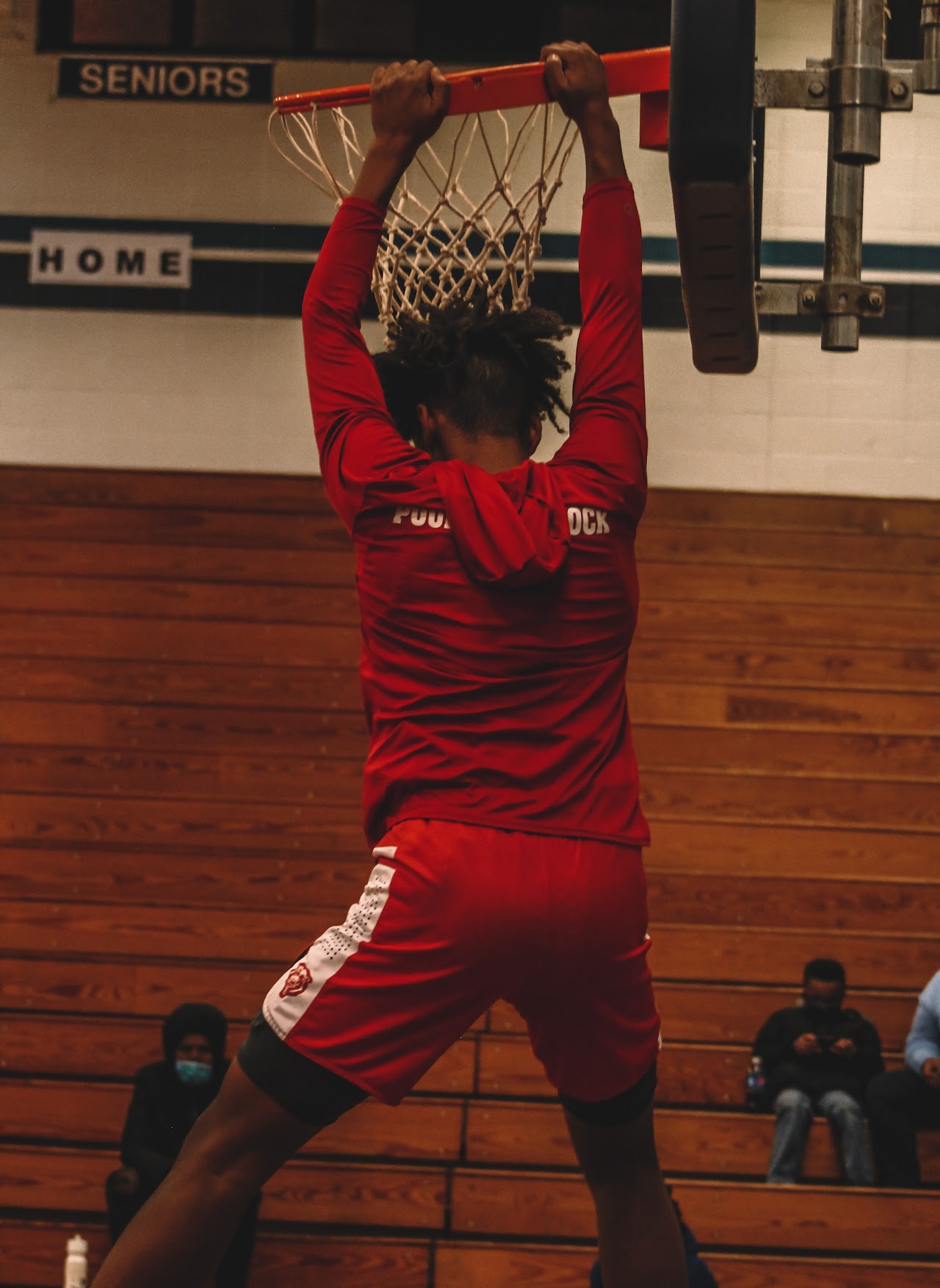 basketball player throwing the ball to the basket