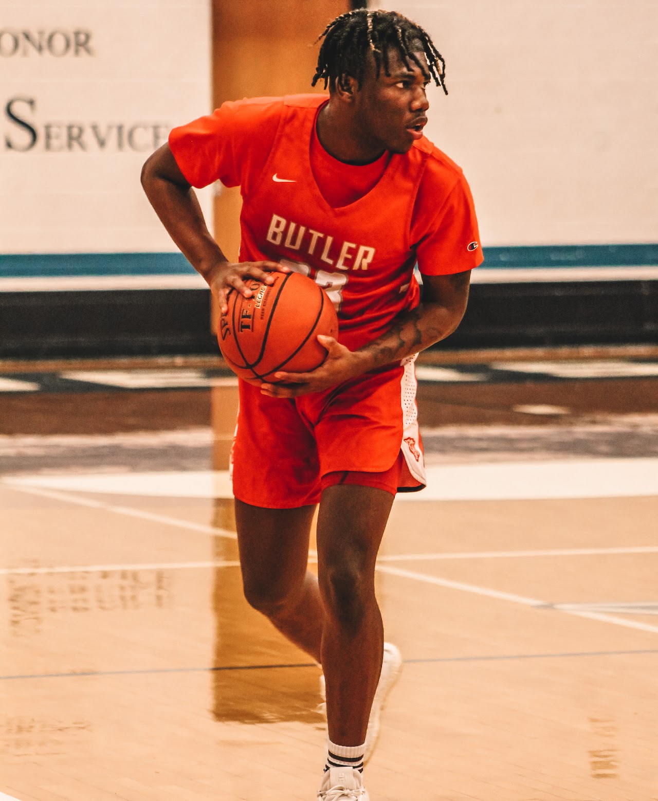 basketball player with the ball and running