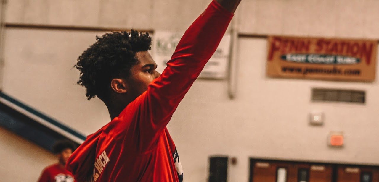 basketball player raising his hand