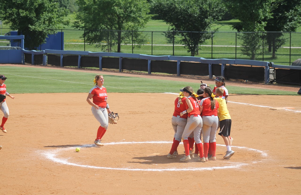 team celebrating a victory hugging