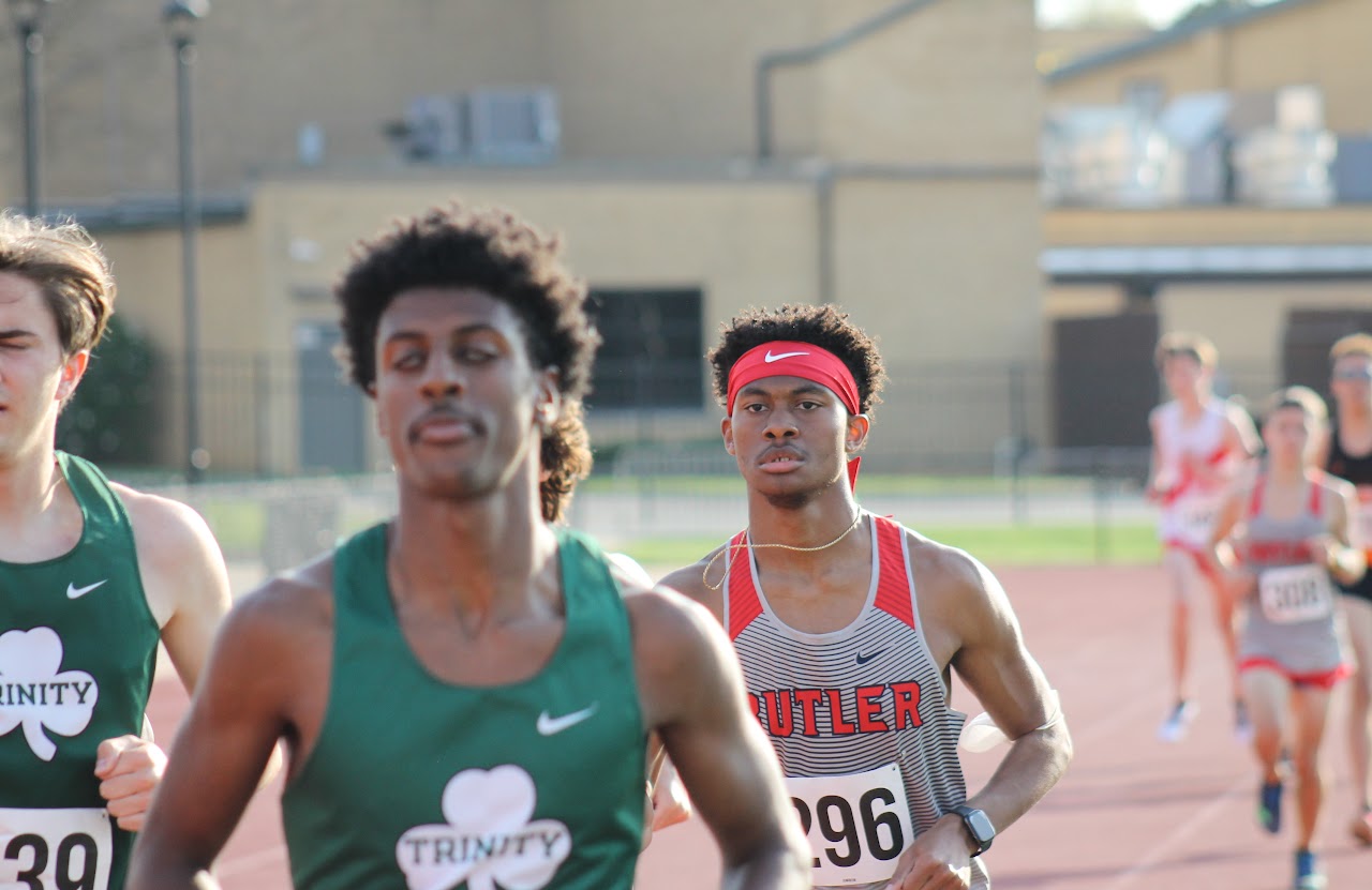 two trackers running on the field