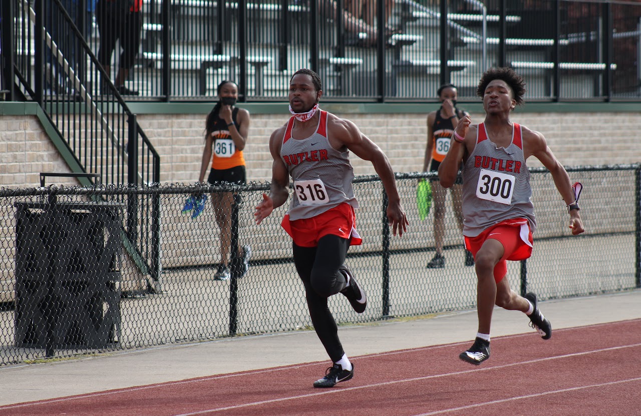 students running on the track field