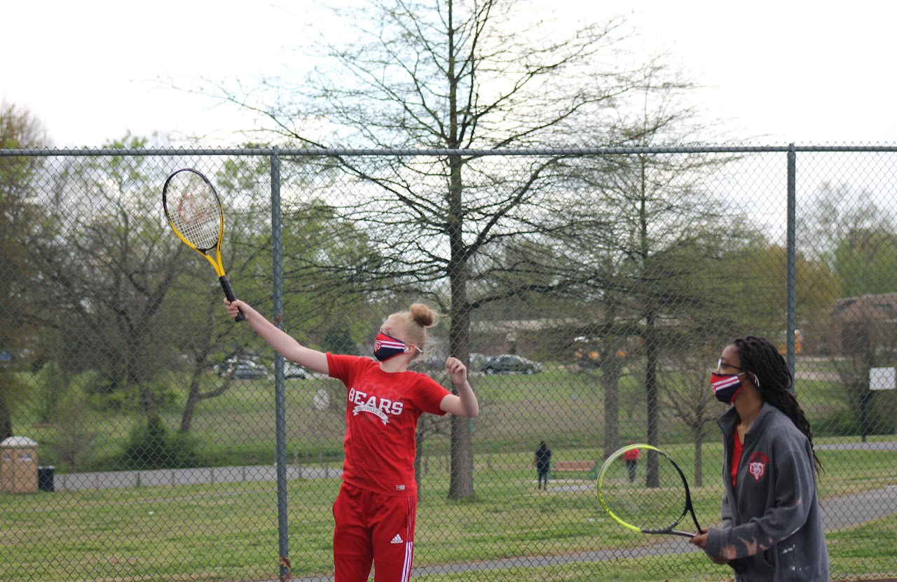 player hitting the ball and jumping