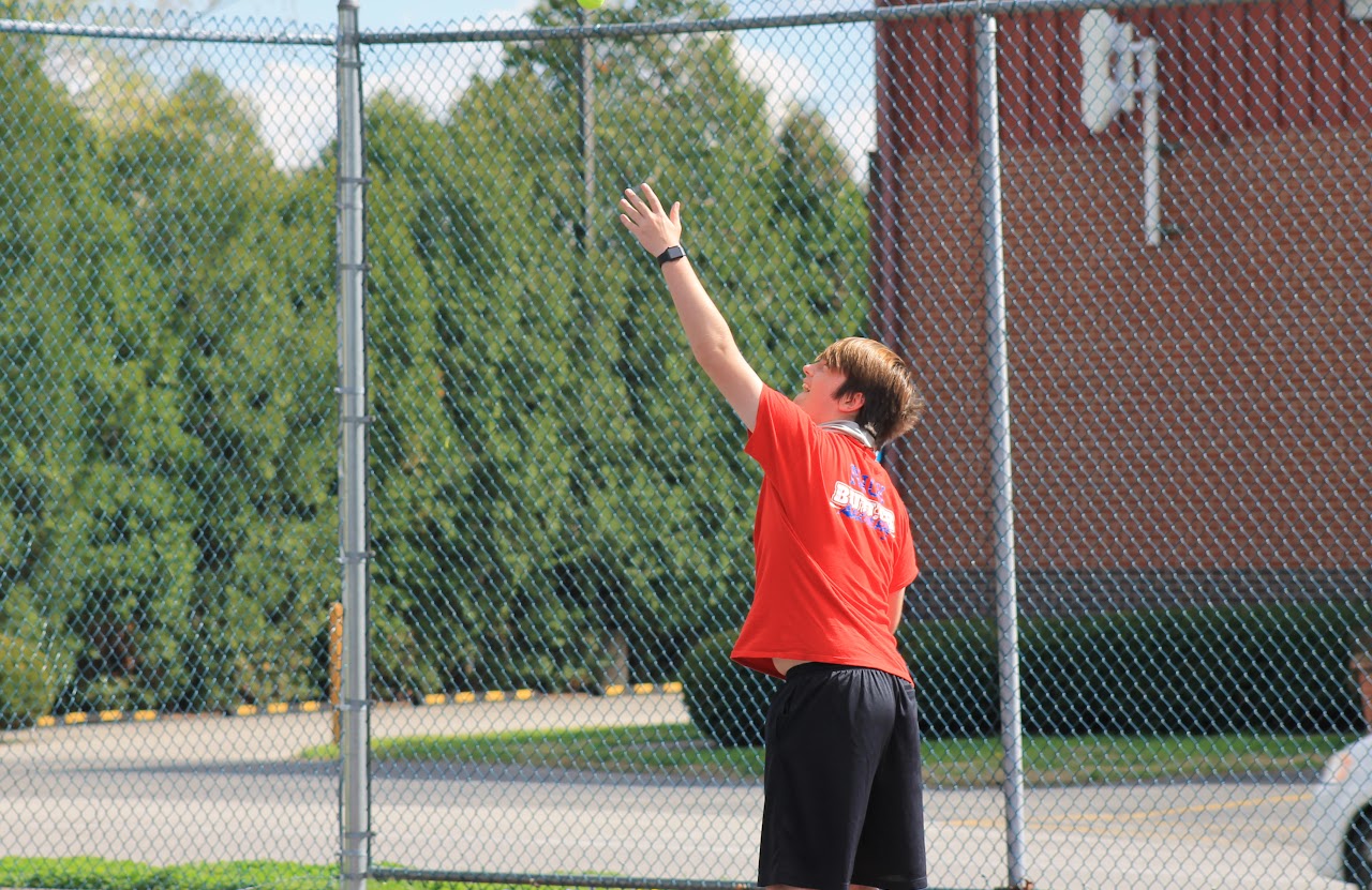 player jumping to hit the ball